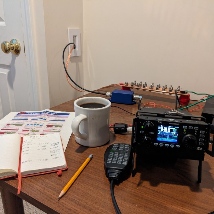 Xeigu G90 Radio with a cup of coffee on a desk
