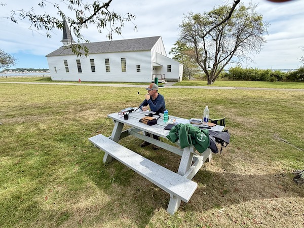 Chris Farnham (W1YTQ) operating the FT-891 on the green in front of the Peddocks Island chapel