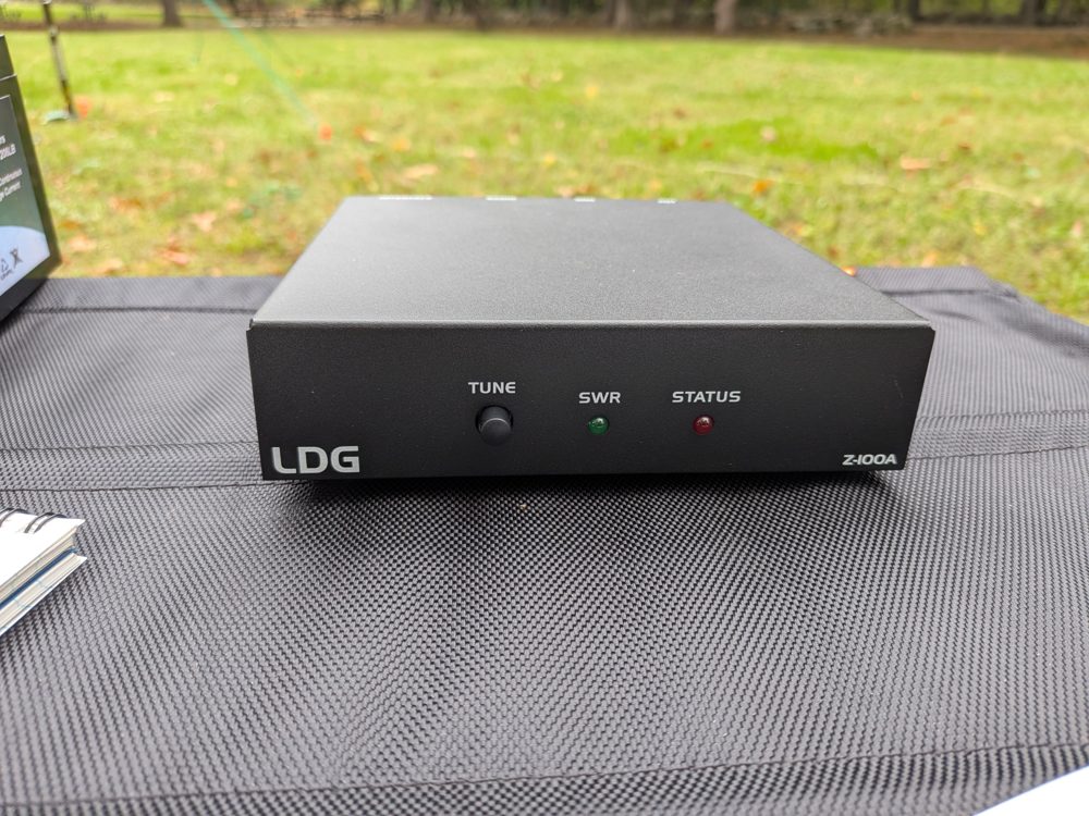 The front of the LDG Z-100A with a TUNE button, an SWR light and a STATUS light