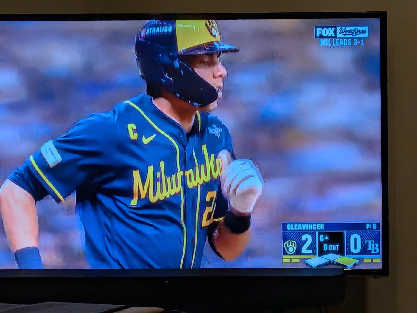 A TV showing the World Series, Milwaukee leading Tampa Bay 2 to 0 in the 6th inning